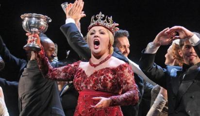 Lady MacBeth (Anna Netrebko) offers a toast